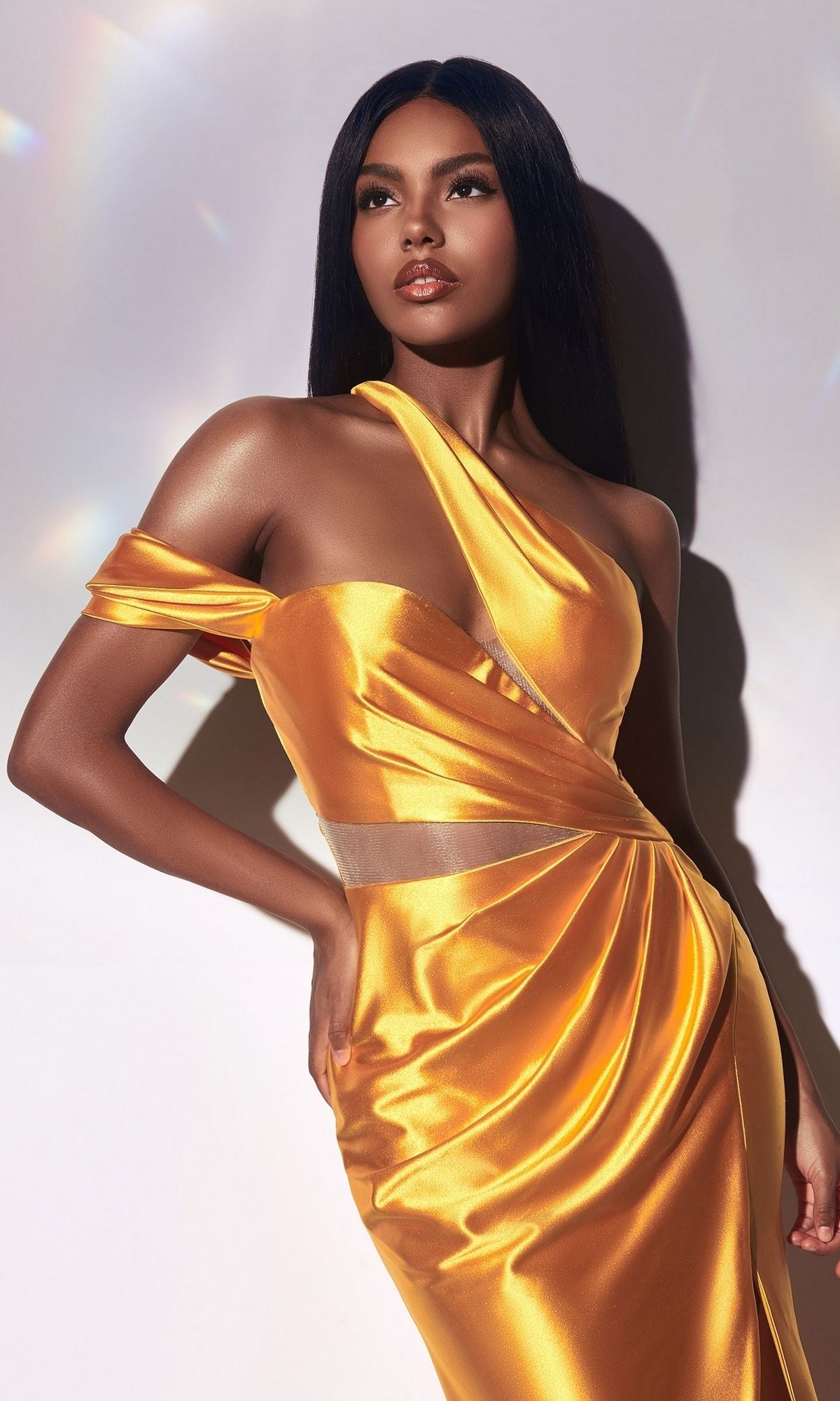 A woman poses against a light background in the One-Shoulder Cut-Out Long Formal Dress Y025, her hair straight and loose.